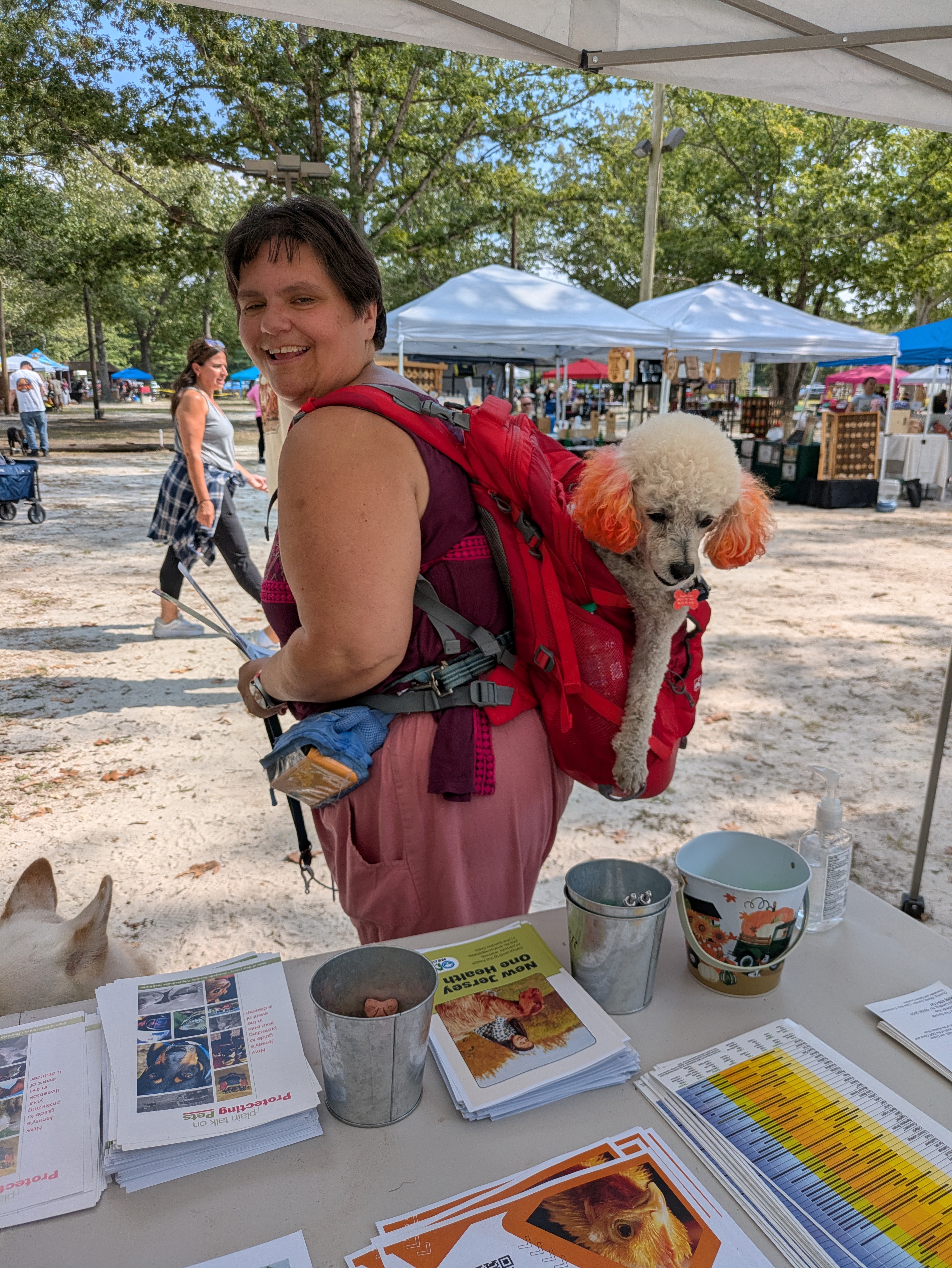 Diana Evans and her dog bean riding in her backpack